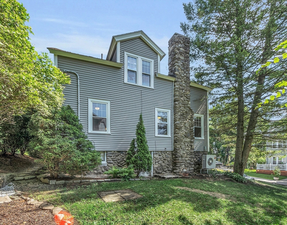 5 Wakefield Street Worcester, MA 01605 - Photo 8 of 42 a front view of a house with a garden