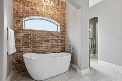 a bathroom with a bathtub and shower