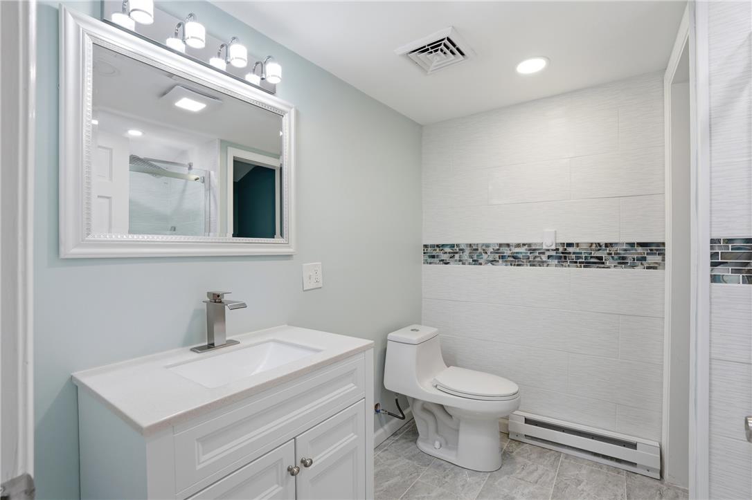 6271 Batman Road Zionsville, PA 18092 - Photo 63 of 100 Clean lines and a mosaic tile accent create a contemporary bathroom.
