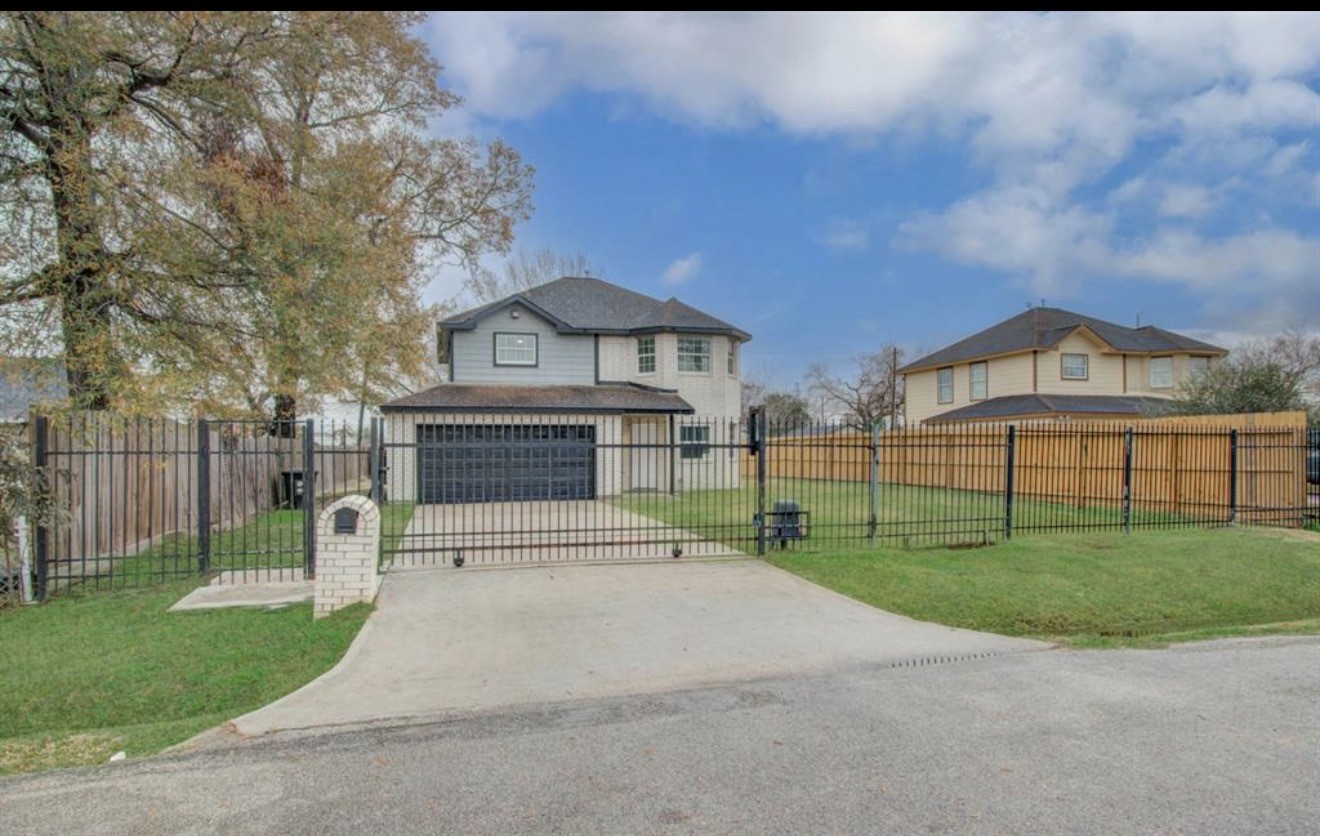3131 Chaffin Street Houston, TX 77087 - Photo 1 of 11 a view of house with a yard and a large tree