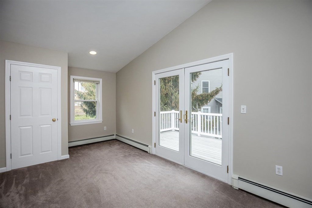 84 Browning Road Arlington, MA 02476 - Photo 19 of 37 an empty room with floor to ceiling window
