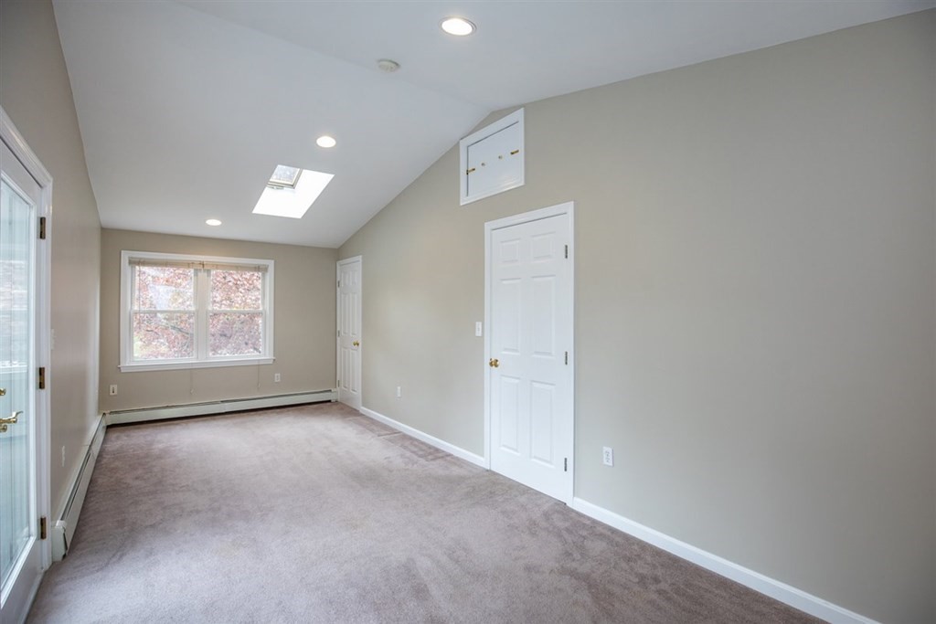 84 Browning Road Arlington, MA 02476 - Photo 20 of 37 a view of an empty room with a window