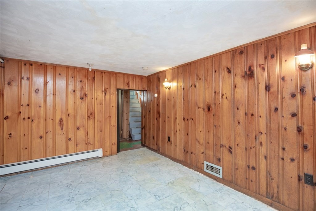 84 Browning Road Arlington, MA 02476 - Photo 27 of 37 a view of a large building with wooden walls