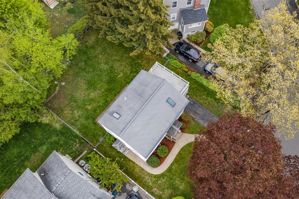 84 Browning Road Arlington, MA 02476 - Photo 34 of 37 an aerial view of a house with a yard