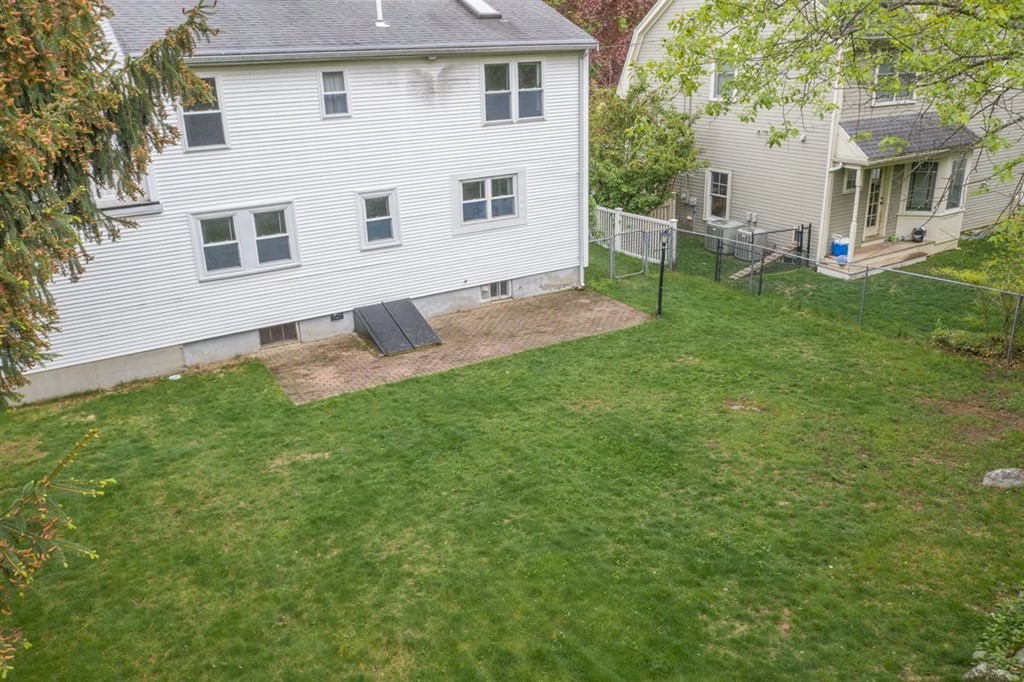 84 Browning Road Arlington, MA 02476 - Photo 36 of 37 a view of an house with backyard and sitting area