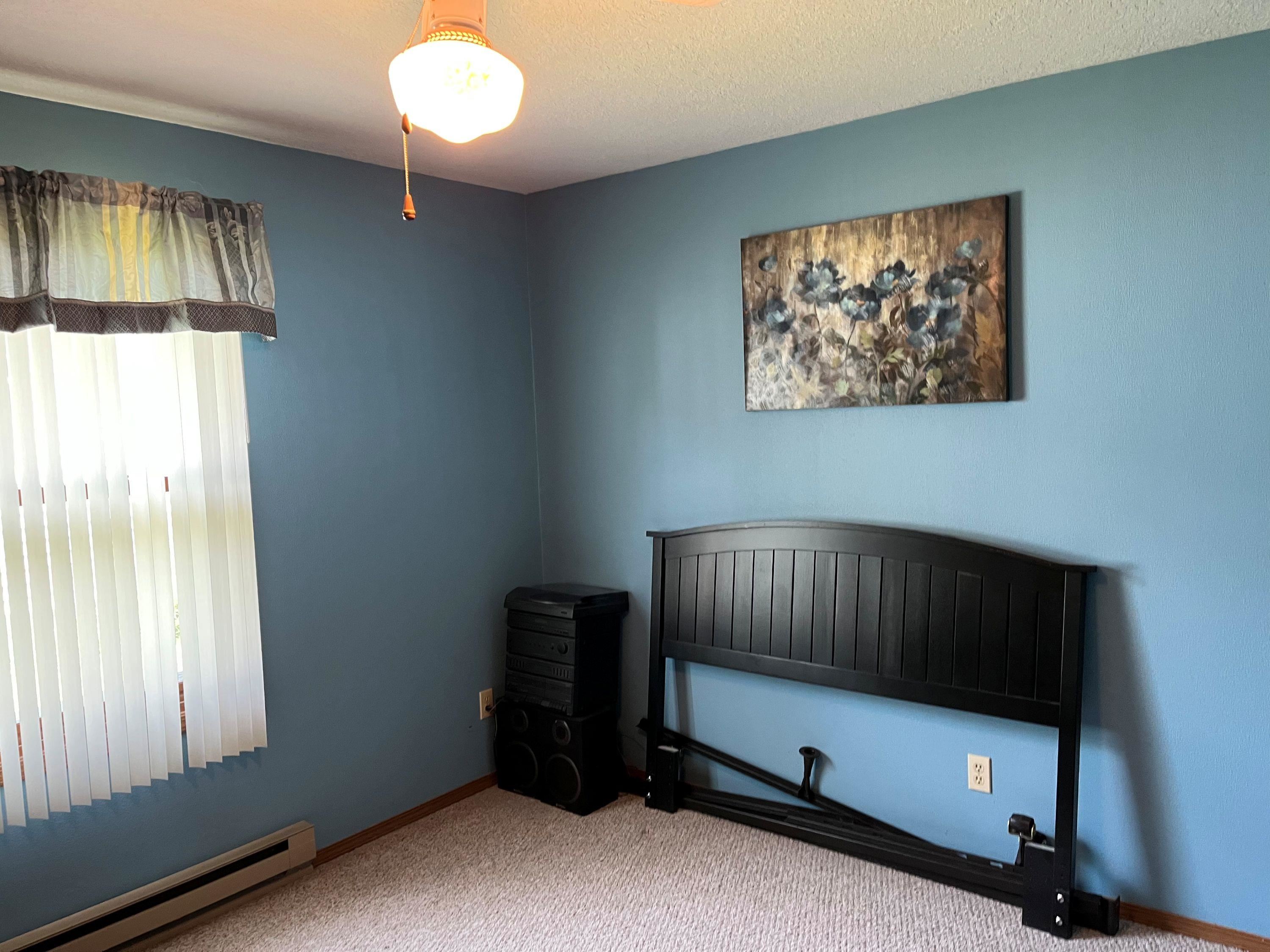 3126 8th Street Rockford, IL 61109 - Photo 5 of 8 a living room with a bed furniture and a window
