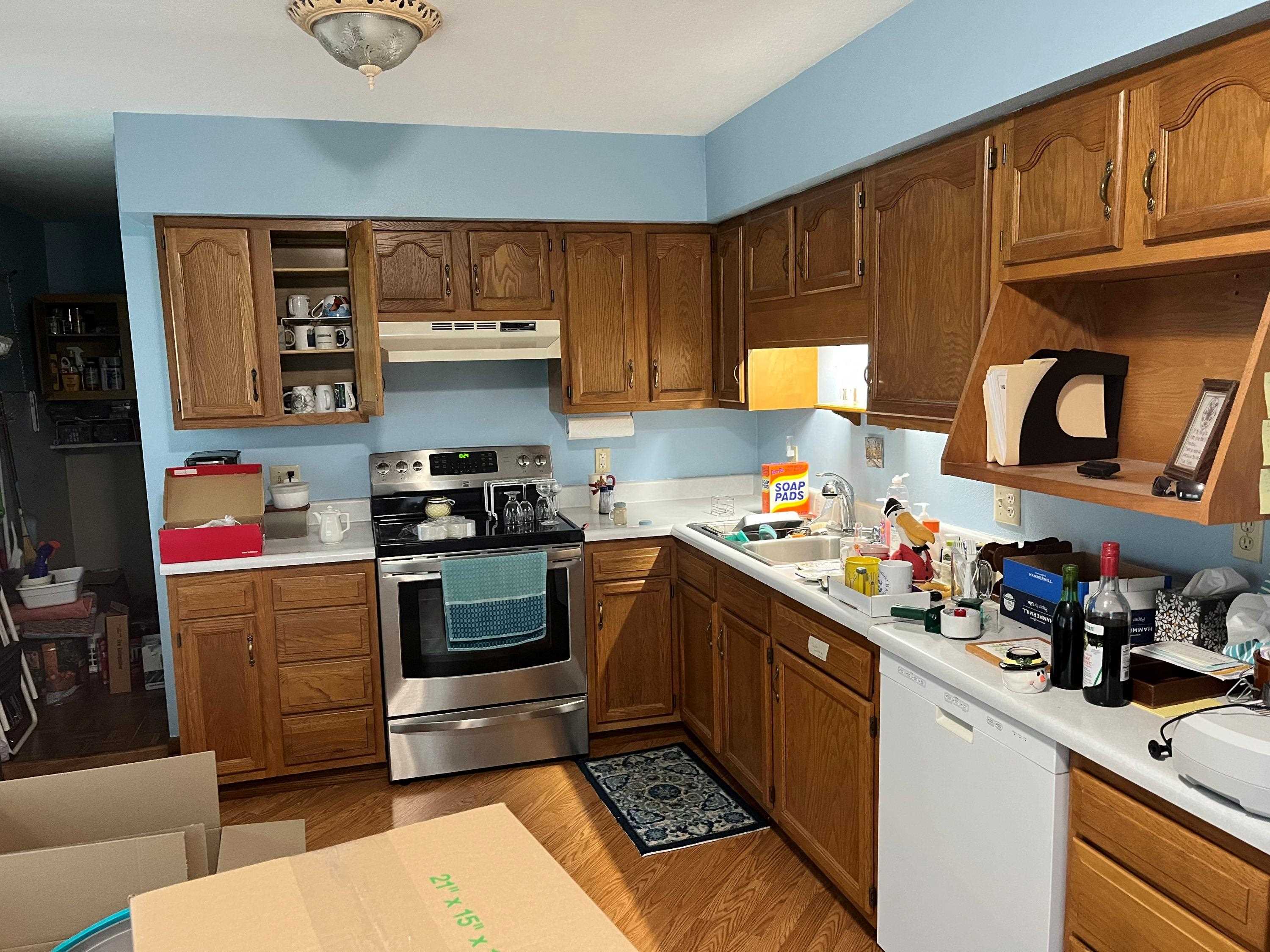 3126 8th Street Rockford, IL 61109 - Photo 6 of 8 a kitchen with stainless steel appliances granite countertop a stove a sink and a cabinets