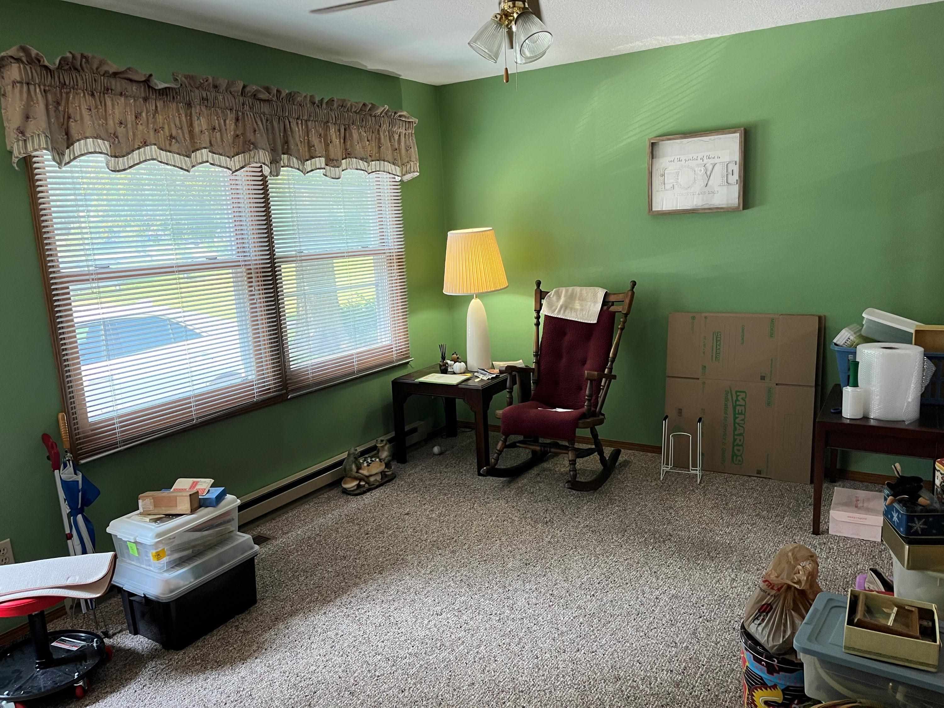 3126 8th Street Rockford, IL 61109 - Photo 7 of 8 a living room with furniture and a window