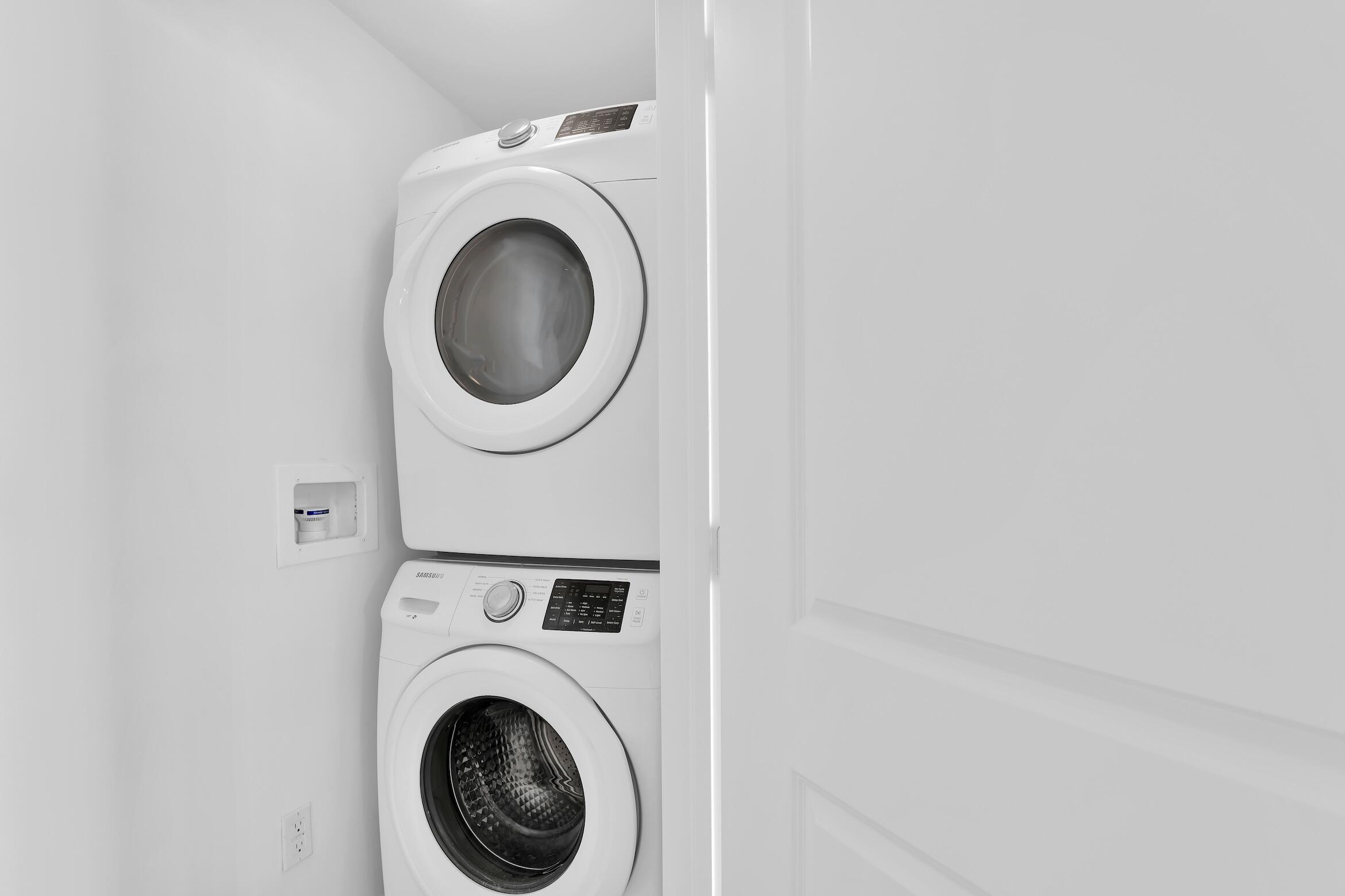 99 Southeast Mizner Boulevard, Unit PH 40 Boca Raton, FL 33432 - Photo 17 of 48 a close up view of a washer and dryer