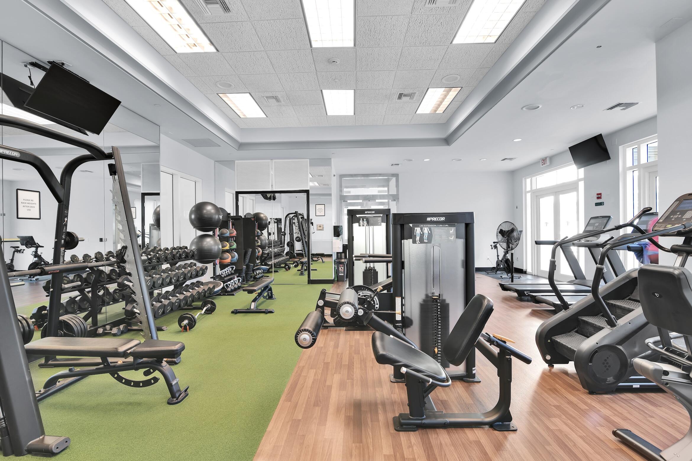 99 Southeast Mizner Boulevard, Unit PH 40 Boca Raton, FL 33432 - Photo 35 of 48 a view of a room with gym equipment