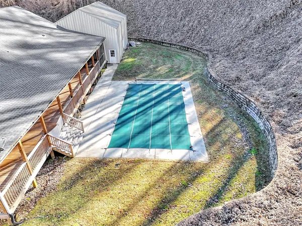 a view of a backyard with a wooden fence