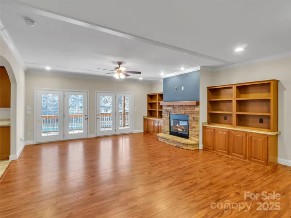 a kitchen with stainless steel appliances granite countertop a refrigerator a stove and a sink