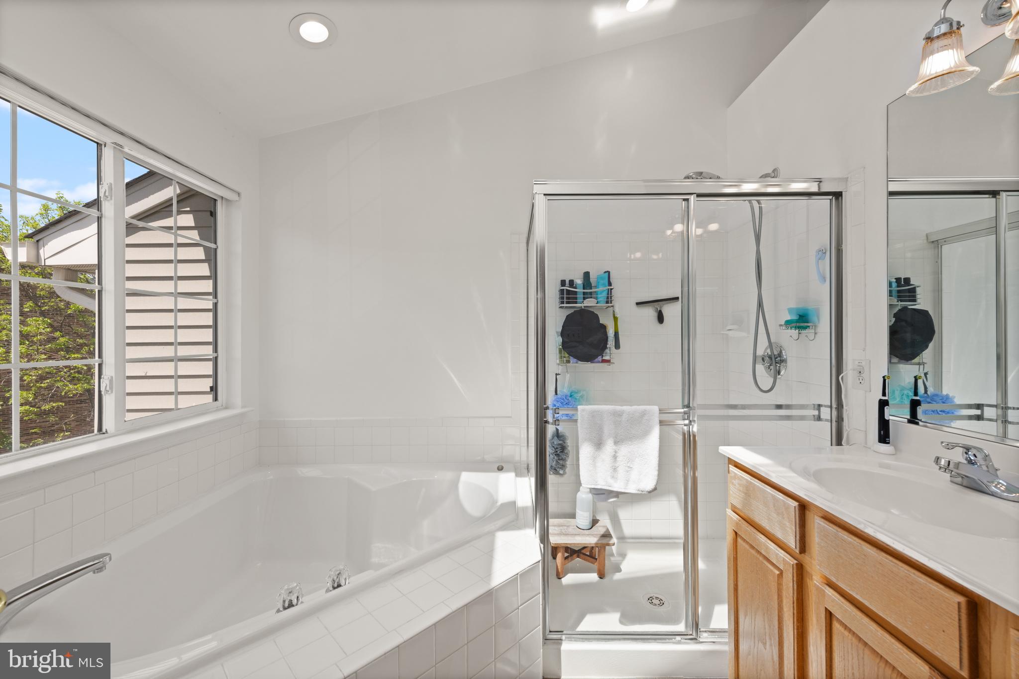 3930 Ballet Way Burtonsville, MD 20866 - Photo 24 of 36 a bathroom with a granite countertop sink a toilet and shower