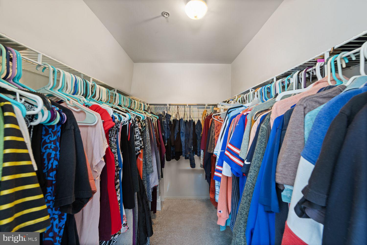 3930 Ballet Way Burtonsville, MD 20866 - Photo 26 of 36 a view of walk in closet with clothes and shoes