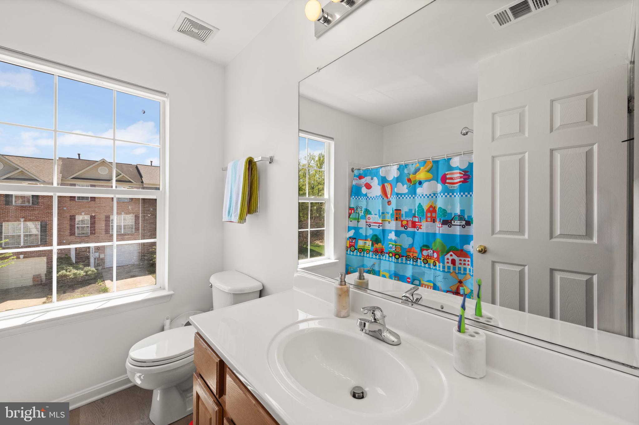 3930 Ballet Way Burtonsville, MD 20866 - Photo 27 of 36 a bathroom with a sink toilet and a mirror