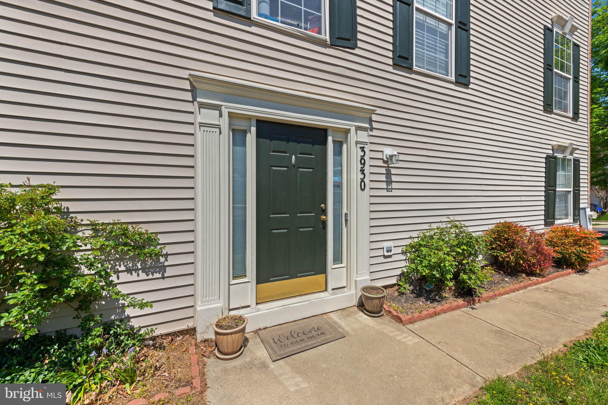 3930 Ballet Way Burtonsville, MD 20866 - Photo 6 of 36 a potted plant sitting in front of a house