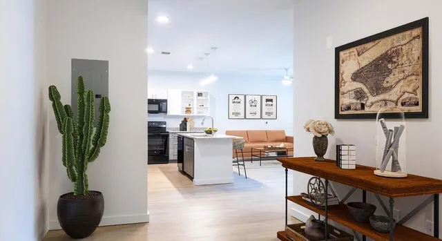 a view of a workspace with furniture and a potted plant
