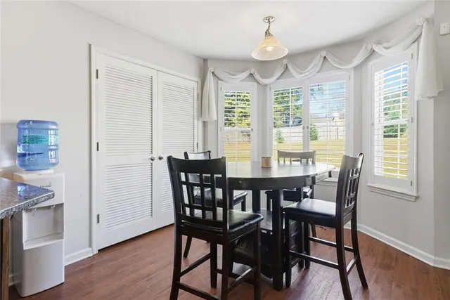 a view of a dining room with furniture window and wooden floor