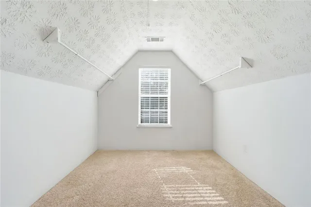 a view of a big room with windows