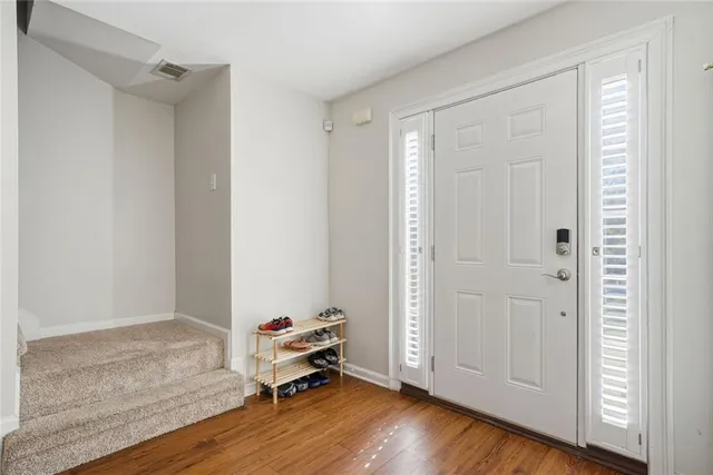 a view of a room with wooden floor and closet