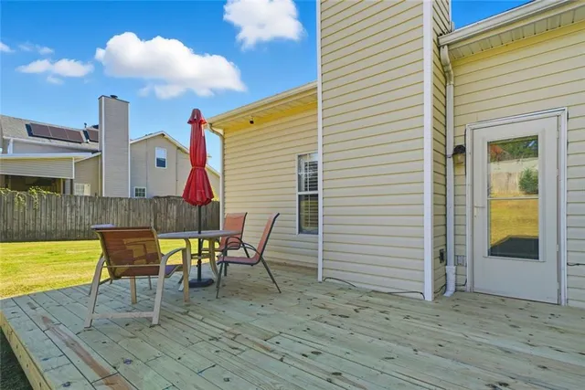 a view of a chairs and table in the patio