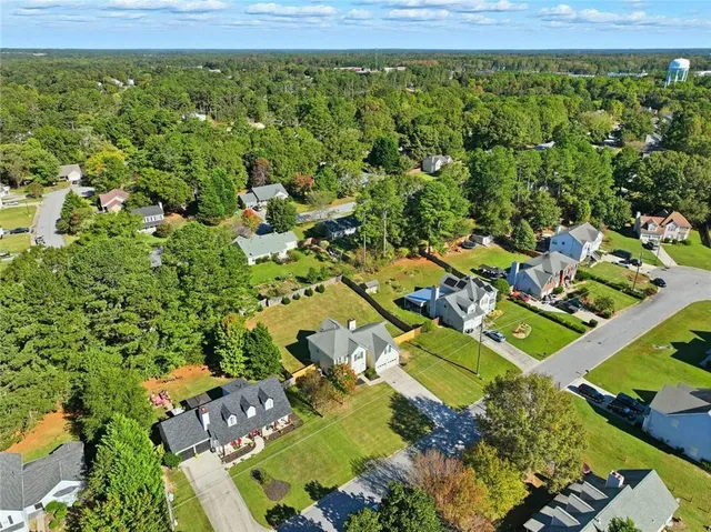 an aerial view of residential houses with outdoor space