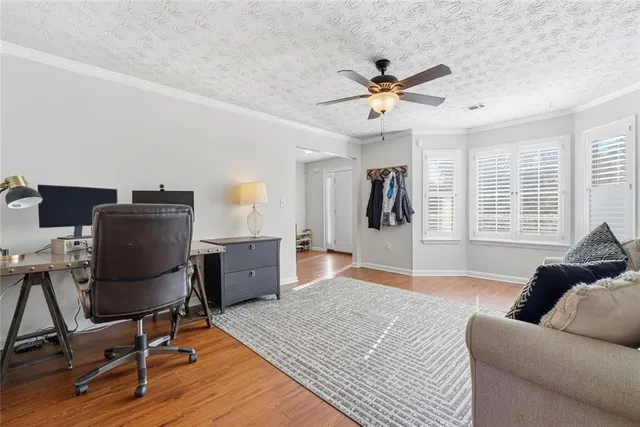 a workspace with furniture hardwood and a window