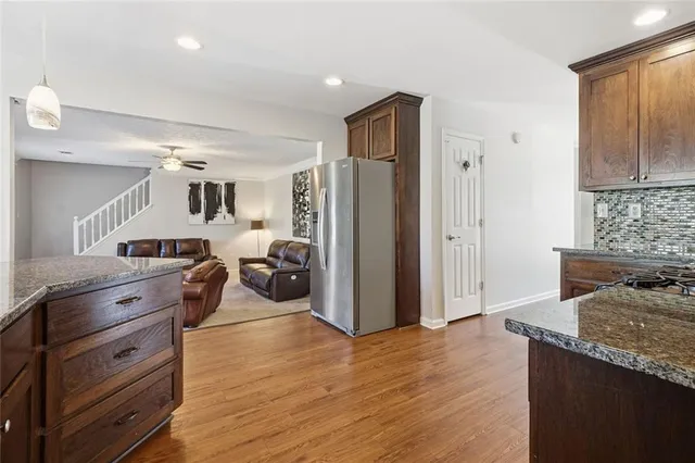 a kitchen with a refrigerator oven and a sink