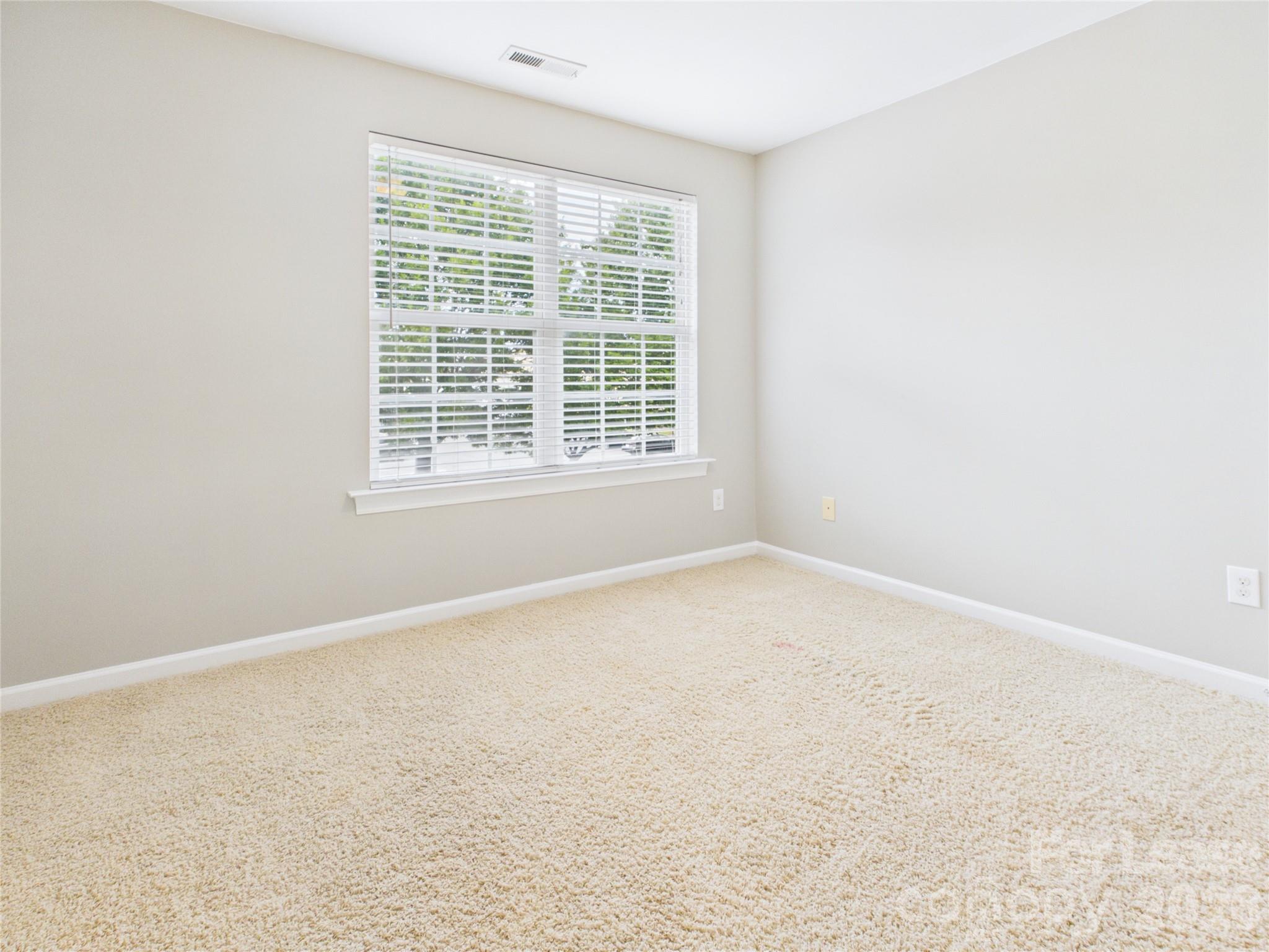 5690 Stafford Road Charlotte, NC 28215 - Photo 16 of 25 an empty room with a window