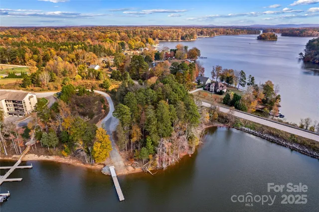a view of residential houses with outdoor space and ocean view