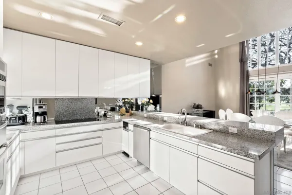 a kitchen with a sink and cabinets