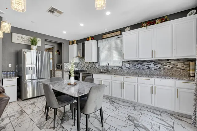 a view of a dining room with furniture