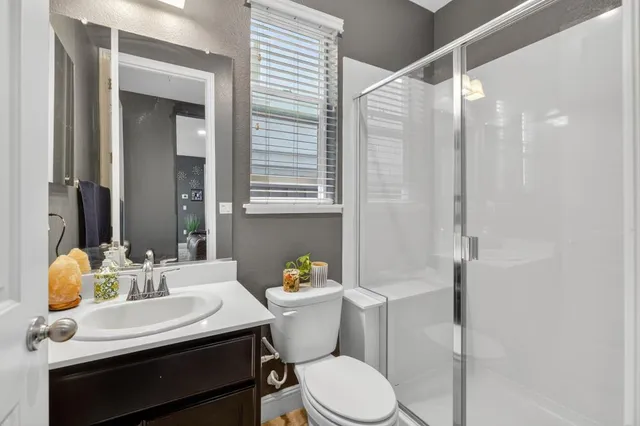 a view of a livingroom with couch and a workspace