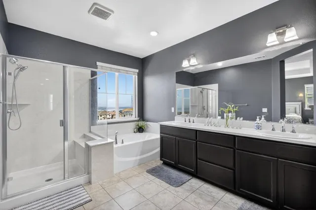 a bathroom with a toilet sink and shower