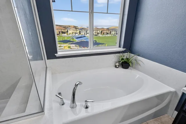 a bathroom with a sink vanity and a mirror