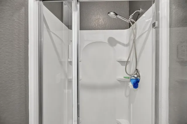 a view of potted plants in front of a building