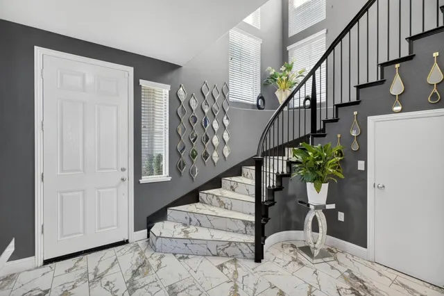 a view of a dining room with furniture wooden floor and chandelier