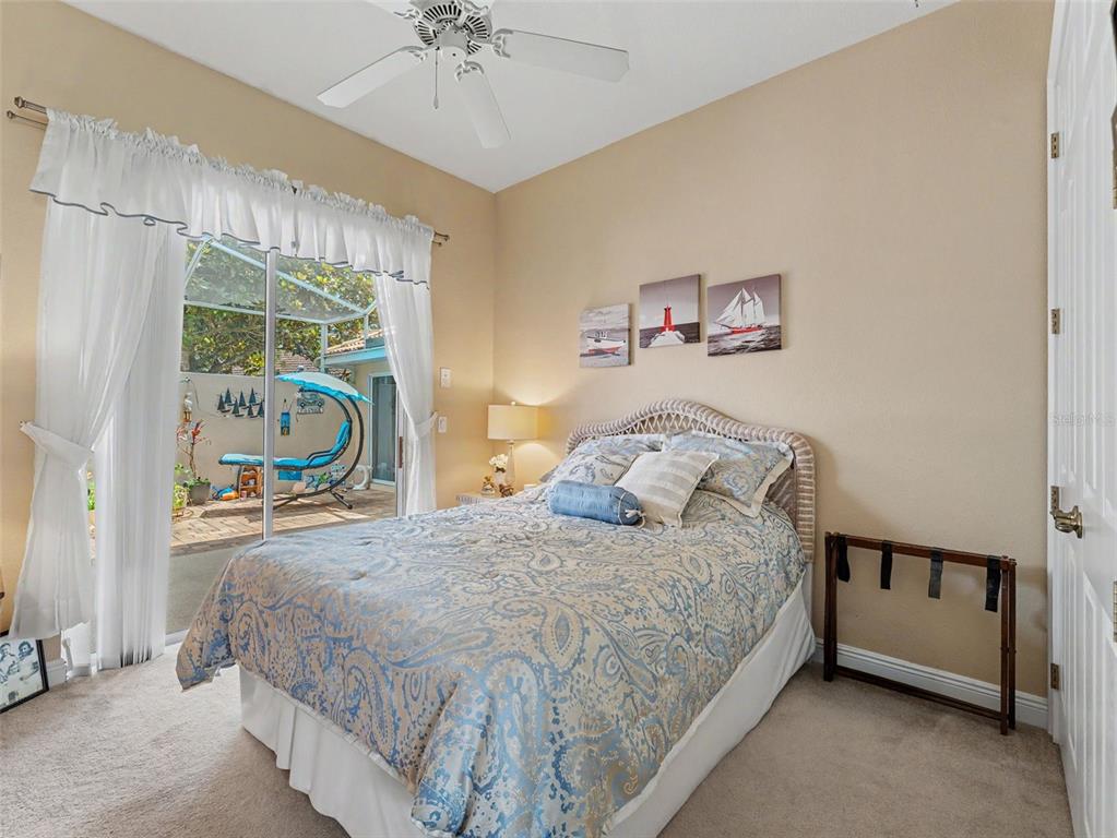 8910 Jericho Road Weeki Wachee, FL 34613 - Photo 38 of 52 a bedroom with a bed and a large window