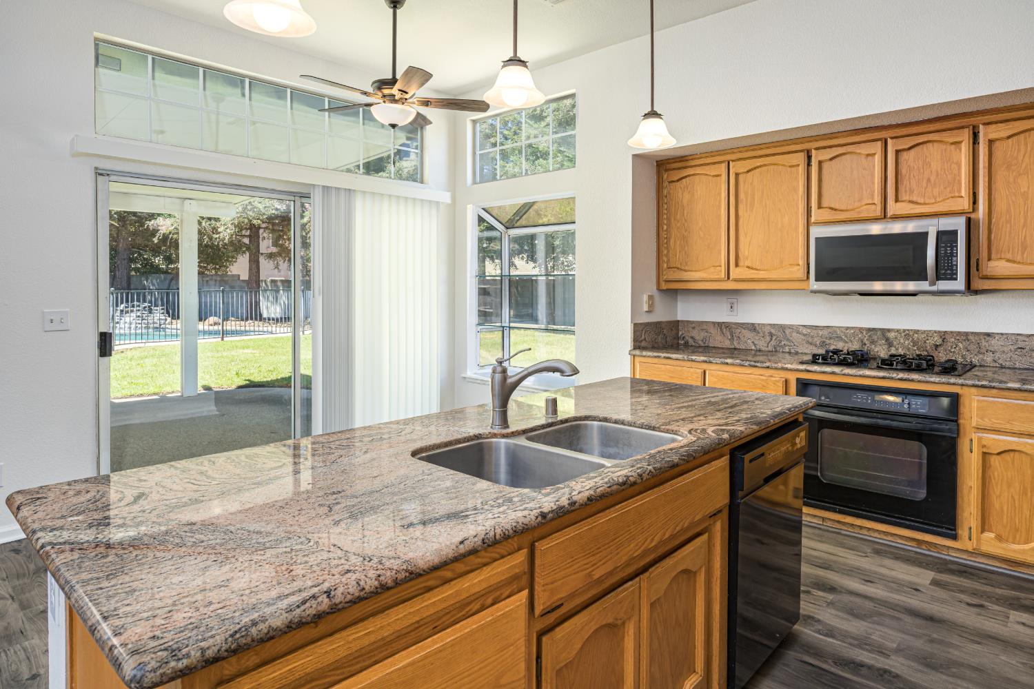 9282 Dever Circle Elk Grove, CA 95624 - Photo 19 of 38 KITCHEN WITH ISLAND SINK