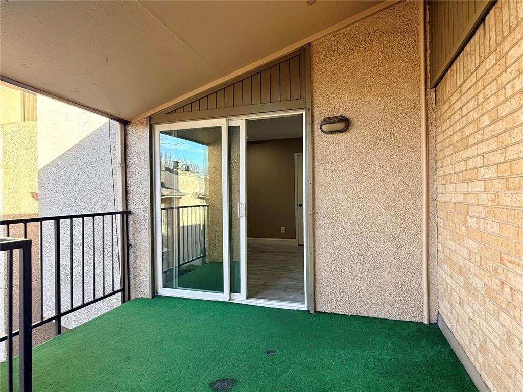 12802 Midway Road, Unit 2015 Dallas, TX 75244 - Photo 13 of 15 a view of backyard with porch