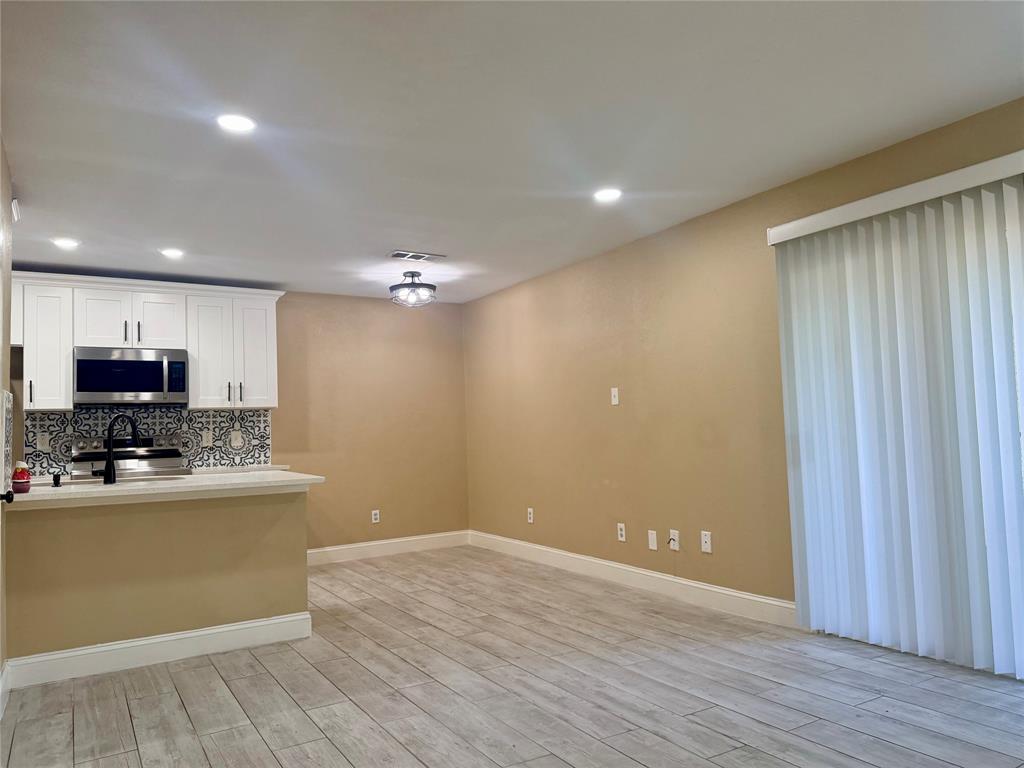 12802 Midway Road, Unit 2015 Dallas, TX 75244 - Photo 5 of 15 a view of a kitchen with cabinets