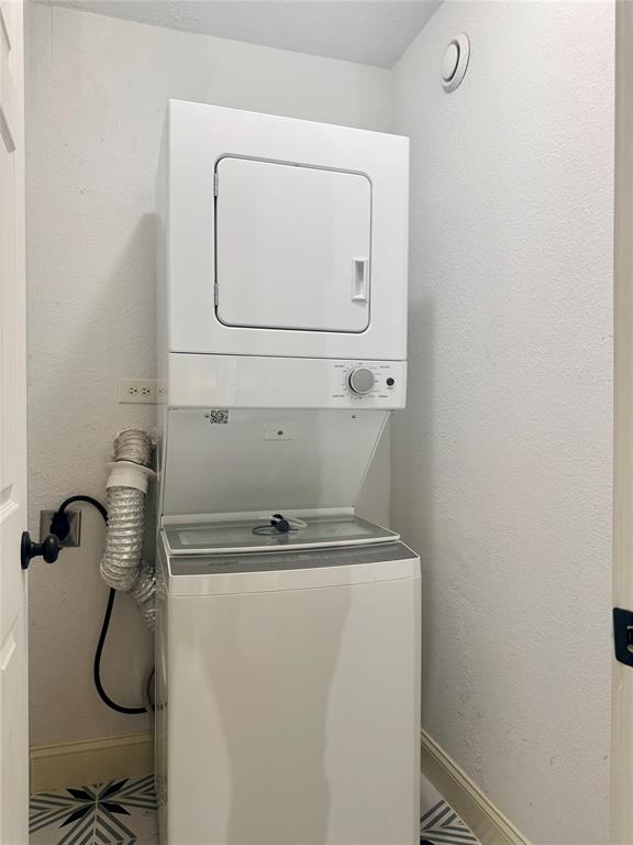 12802 Midway Road, Unit 2015 Dallas, TX 75244 - Photo 7 of 15 a close view of utility room with washer and dryer