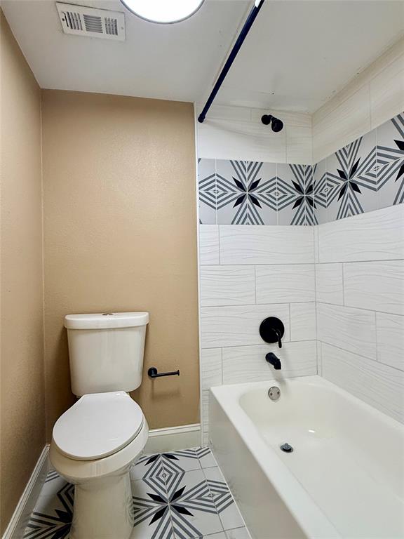 12802 Midway Road, Unit 2015 Dallas, TX 75244 - Photo 9 of 15 a bathroom with a sink a toilet and shower