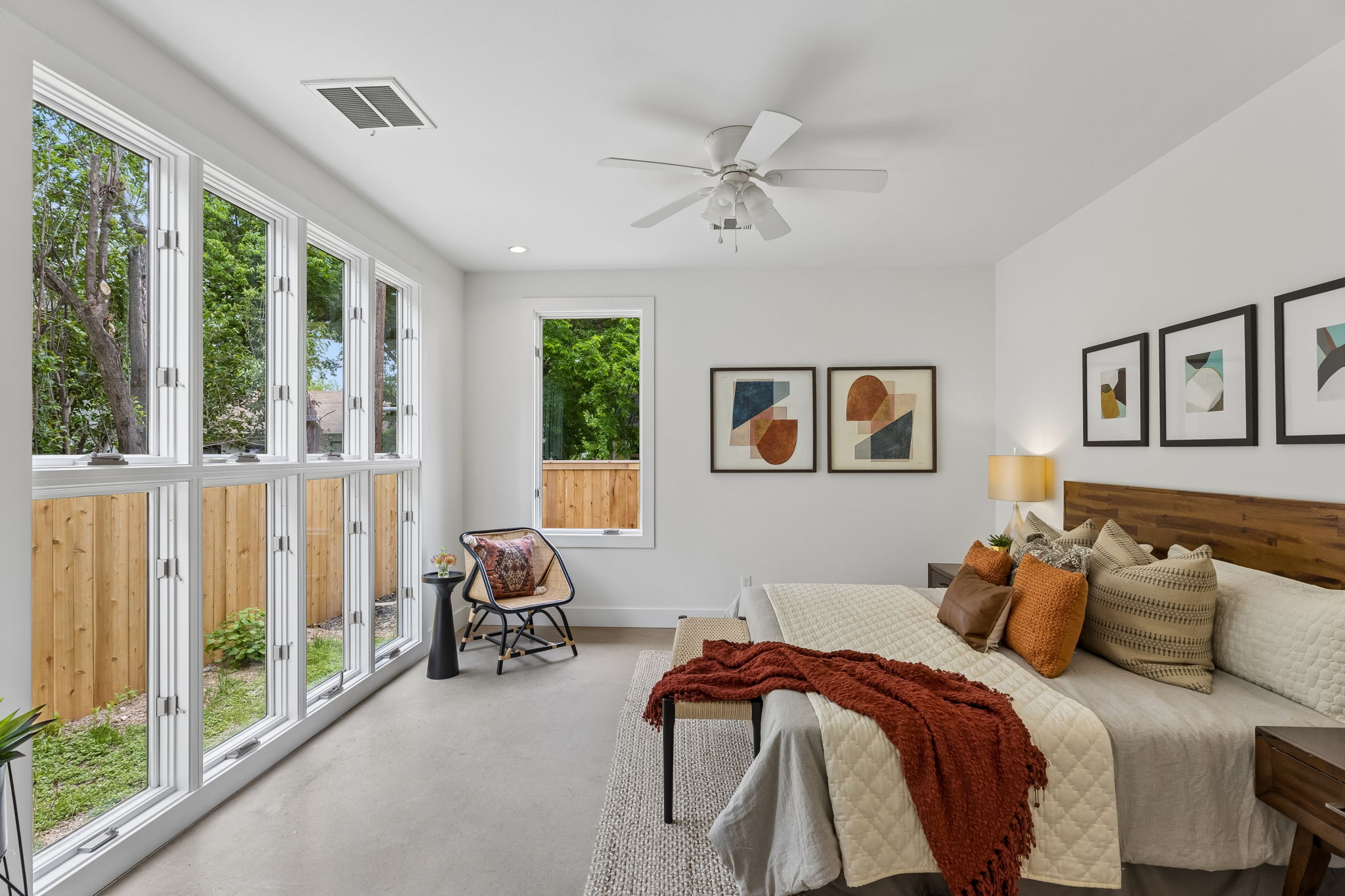5305 Guadalupe Street, Unit A Austin, TX 78751 - Photo 11 of 31 King Sized Bedroom featuring finished concrete flooring and ceiling fan