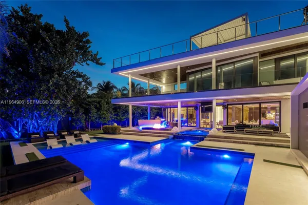 a view of a swimming pool with a table and chairs
