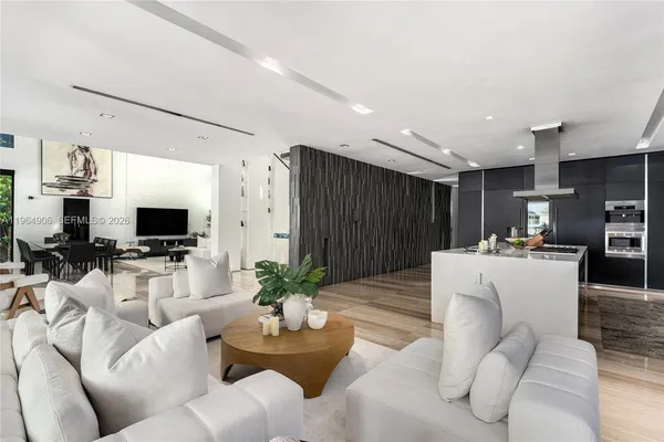 a potted plant sitting in front of a house with a yard