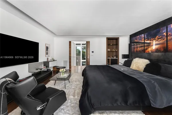 a bathroom with a sink mirror and a shower