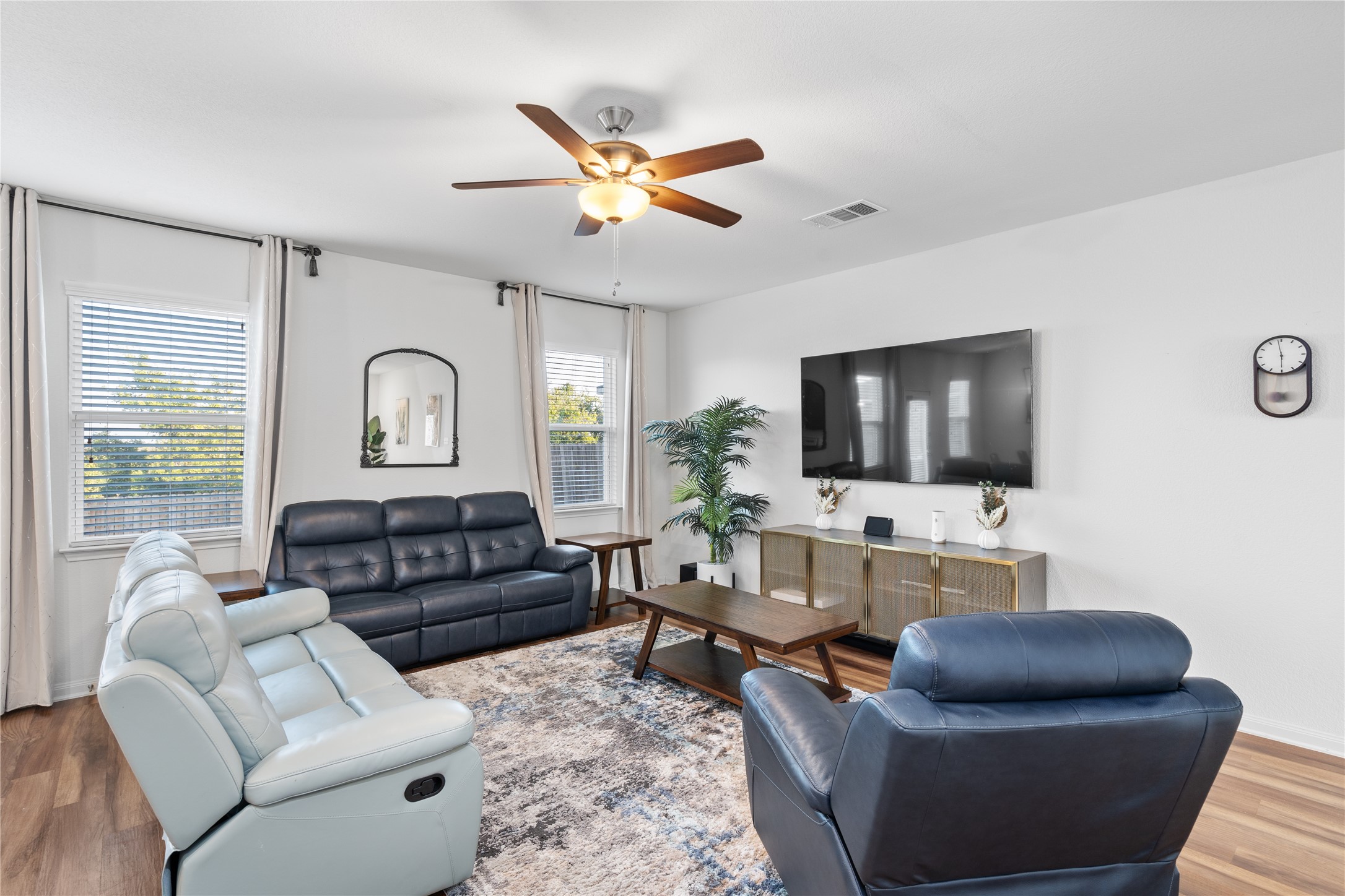20205 Grover Cleveland Way Manor, TX 78653 - Photo 8 of 26 a living room with furniture and a flat screen tv