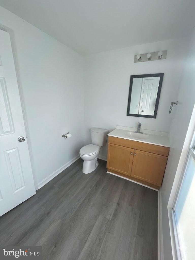 172 Rogers Mill Road Strasburg, VA 22657 - Photo 22 of 23 a bathroom with a toilet a sink and mirror