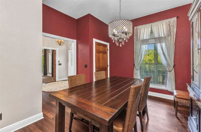 a bathroom with a granite countertop sink a mirror and vanity